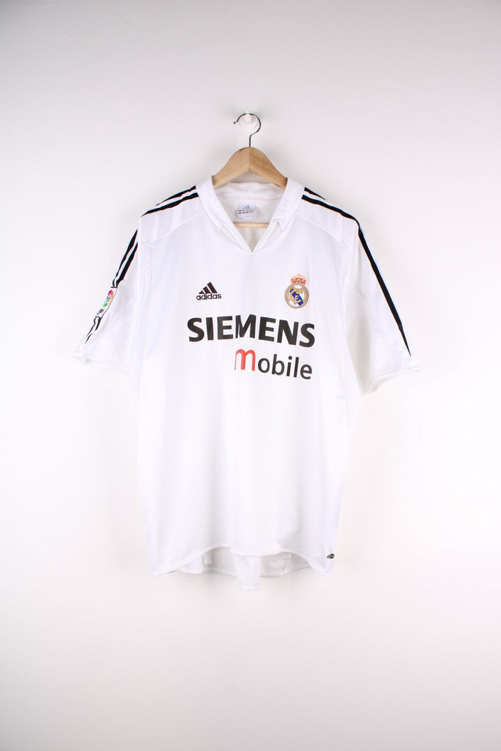 Real Madrid 2004/05 Adidas Football Shirt in the white home kit colourway, features embroidered logos and badge on the front.