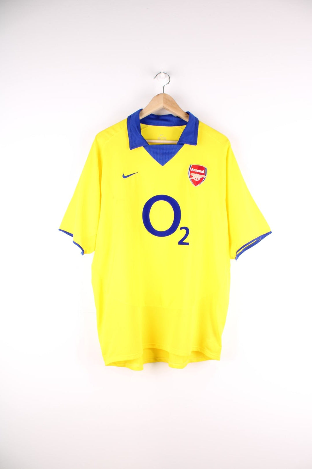 Arsenal 2003/04 Nike Football Shirt in the yellow away kit colourway, features embroidered logos and badge on the front.