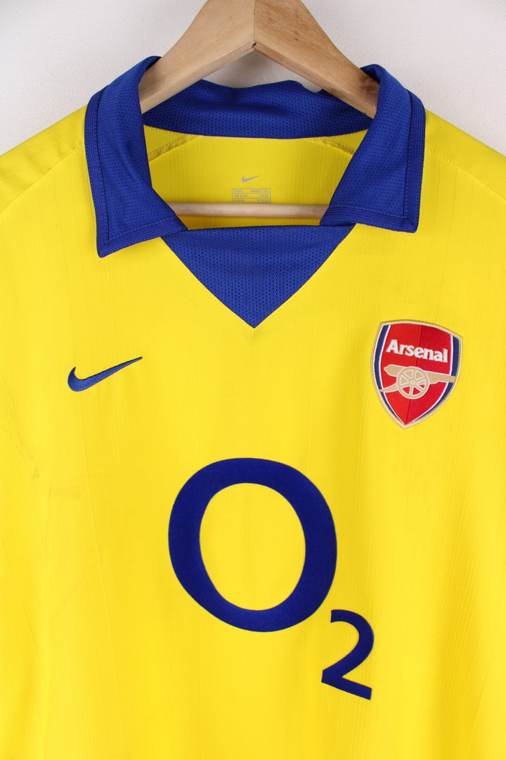 Arsenal 2003/04 Nike Football Shirt in the yellow away kit colourway, features embroidered logos and badge on the front.