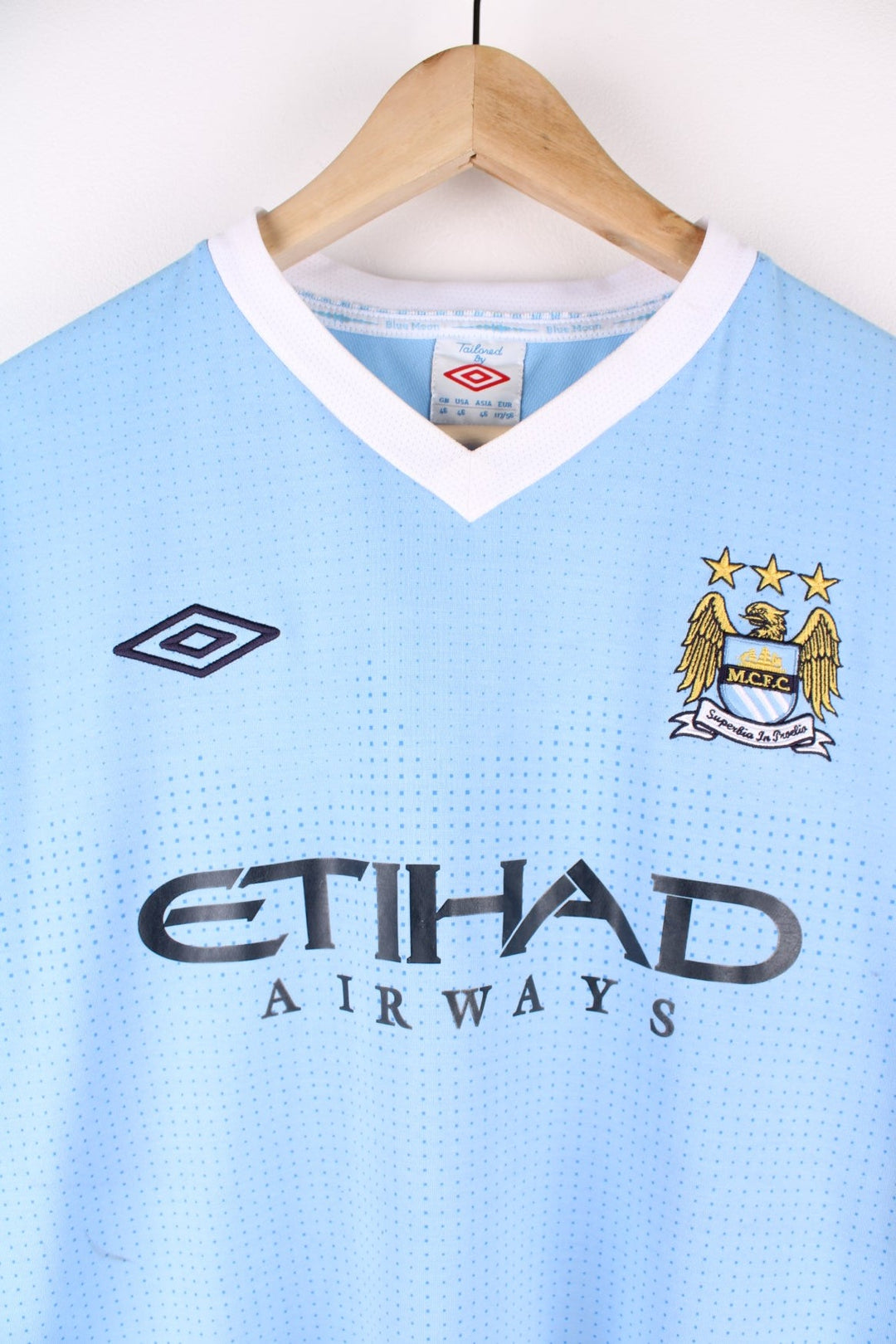 Manchester City 2011/12 Umbro Football Shirt in the blue home kit colourway, features embroidered logos and badge on the front.