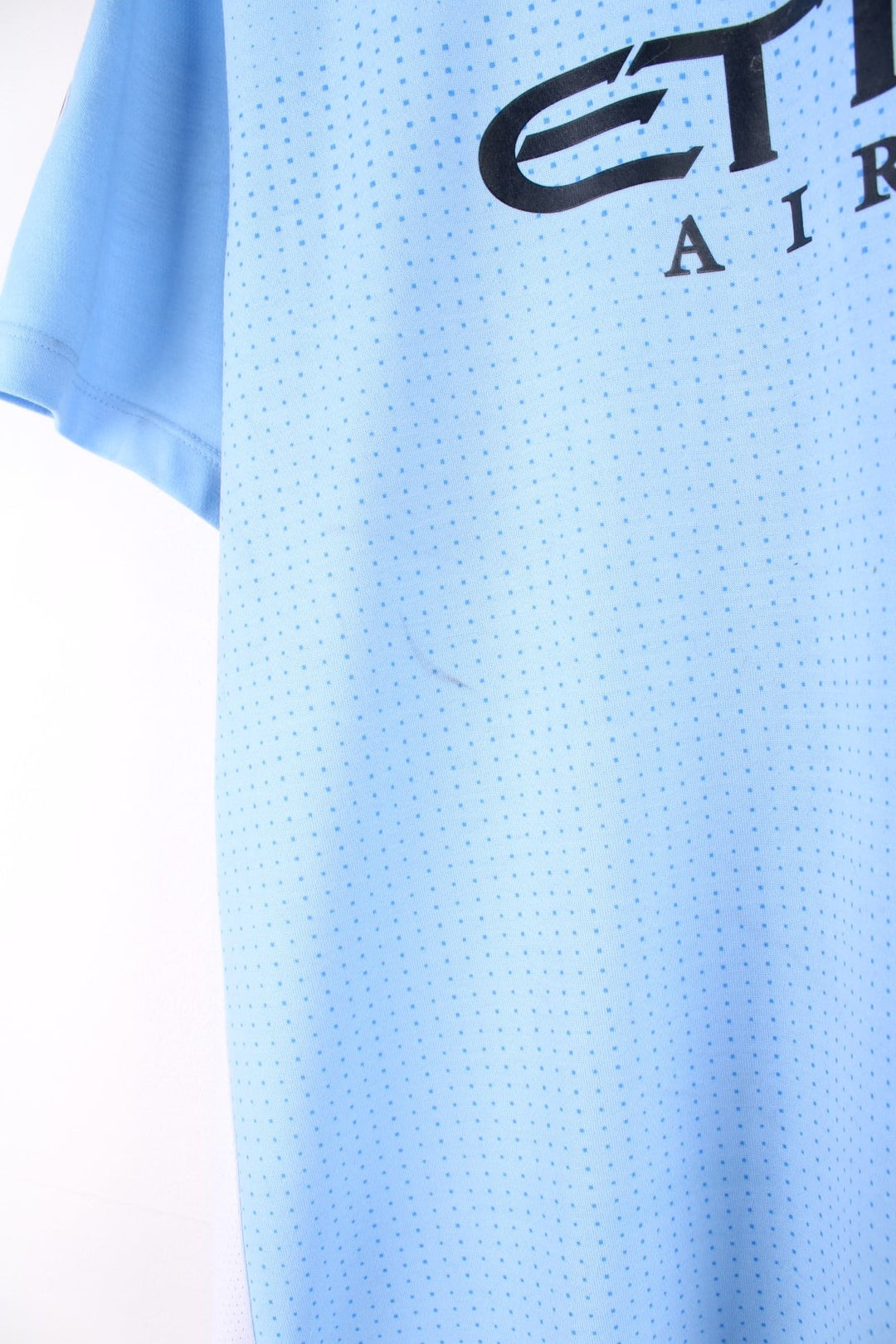 Manchester City 2011/12 Umbro Football Shirt in the blue home kit colourway, features embroidered logos and badge on the front.