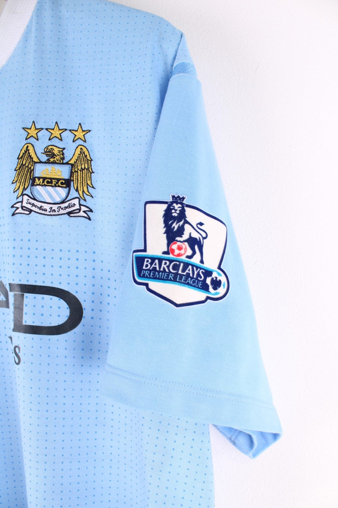 Manchester City 2011/12 Umbro Football Shirt in the blue home kit colourway, features embroidered logos and badge on the front.