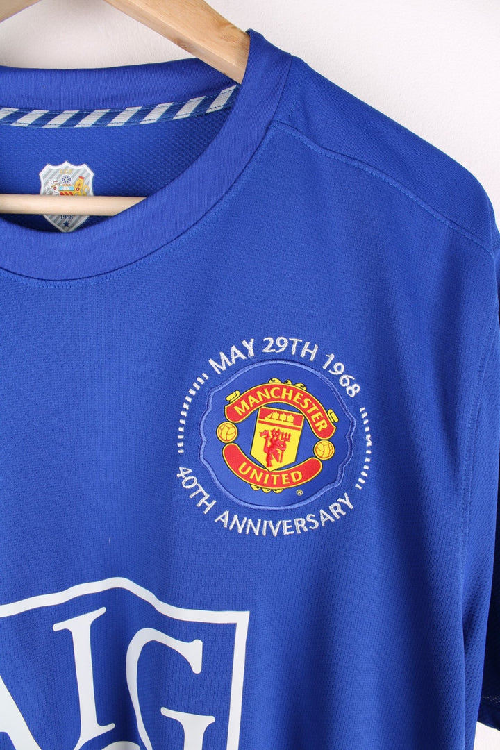 Manchester United 2008/09 Nike Football Shirt in the blue third kit colourway, features embroidered logos and badge on the front.