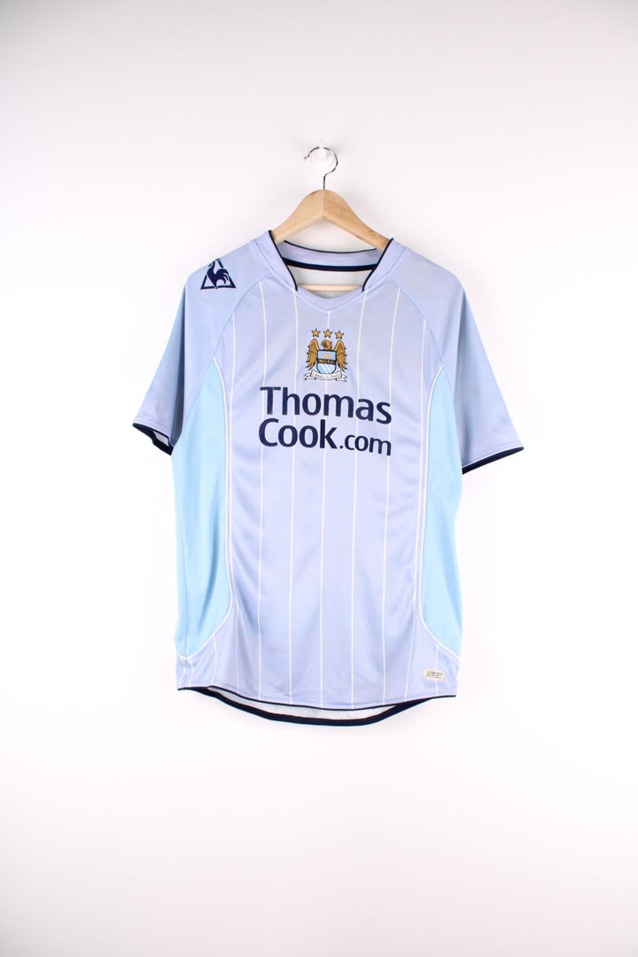 Manchester City 2007/08 Le Coq Sportif Football Shirt in the blue home kit colourway, features embroidered logos and badge on the front, and Elano number 11 printed on the back.