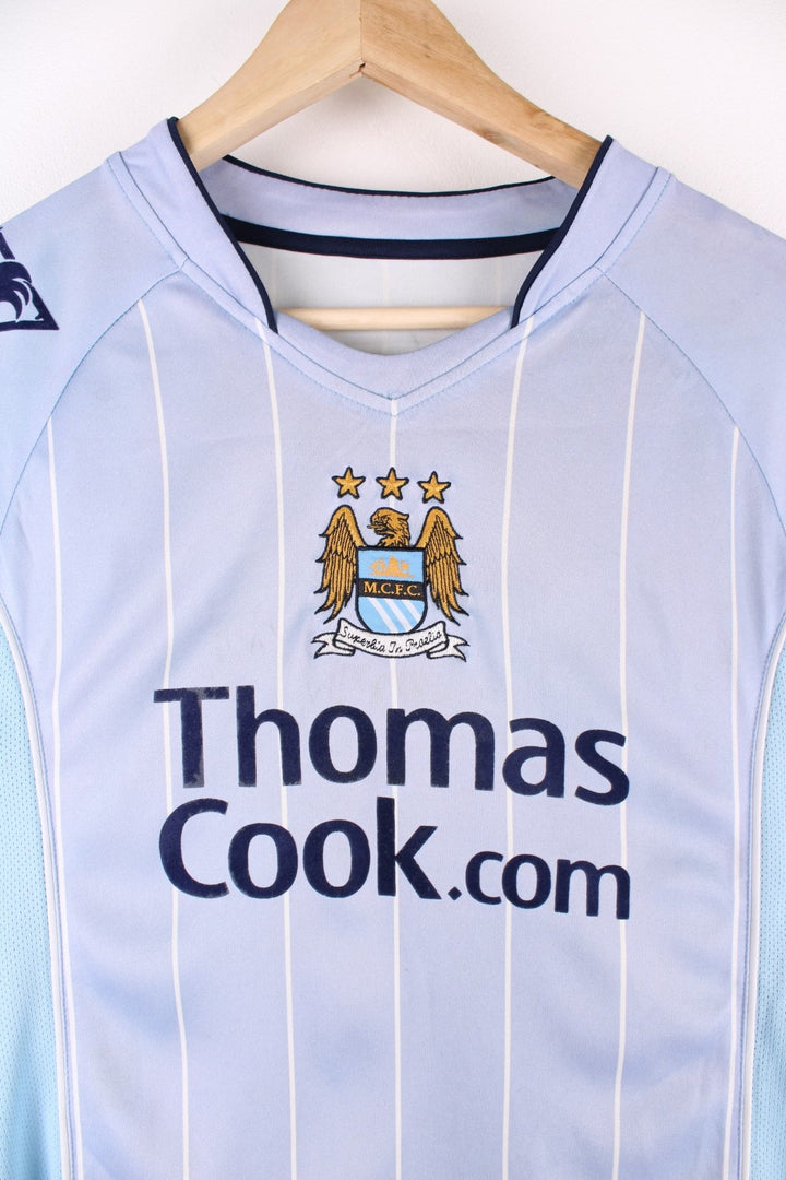 Manchester City 2007/08 Le Coq Sportif Football Shirt in the blue home kit colourway, features embroidered logos and badge on the front, and Elano number 11 printed on the back.