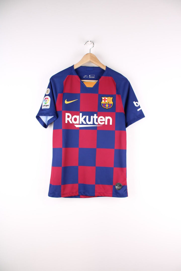 Barcelona Nike Football Shirt in the blue and red home kit colourway, features embroidered logos and badge on the front, and Messi number 10 printed on the back.