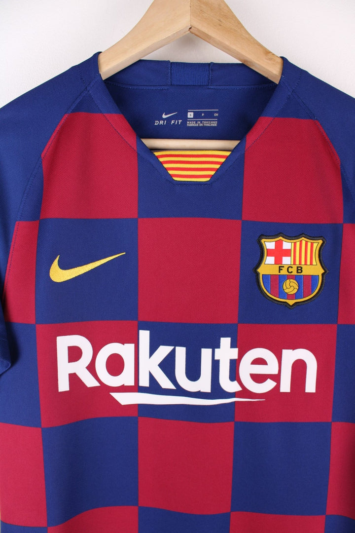 Barcelona Nike Football Shirt in the blue and red home kit colourway, features embroidered logos and badge on the front, and Messi number 10 printed on the back.