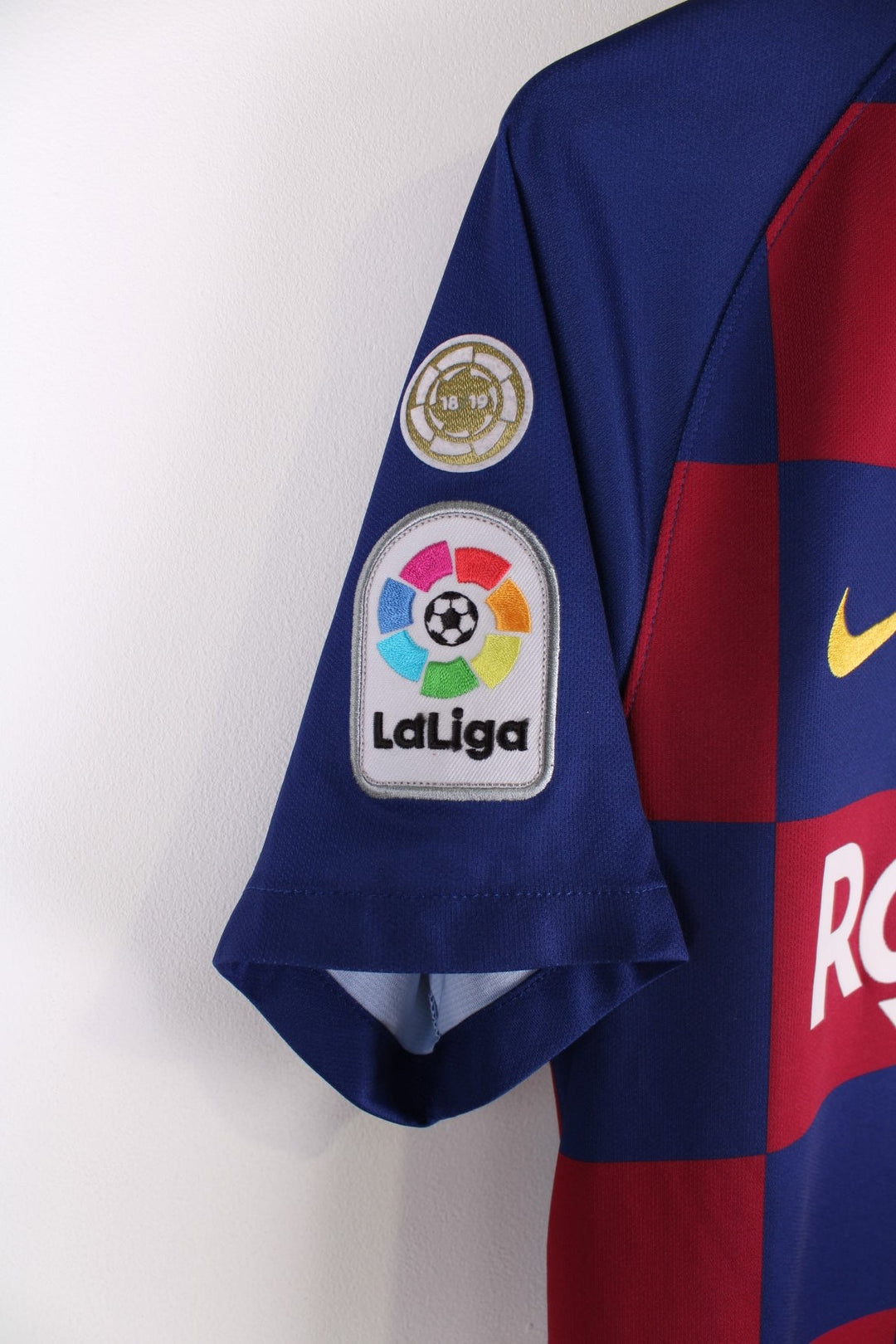 Barcelona Nike Football Shirt in the blue and red home kit colourway, features embroidered logos and badge on the front, and Messi number 10 printed on the back.