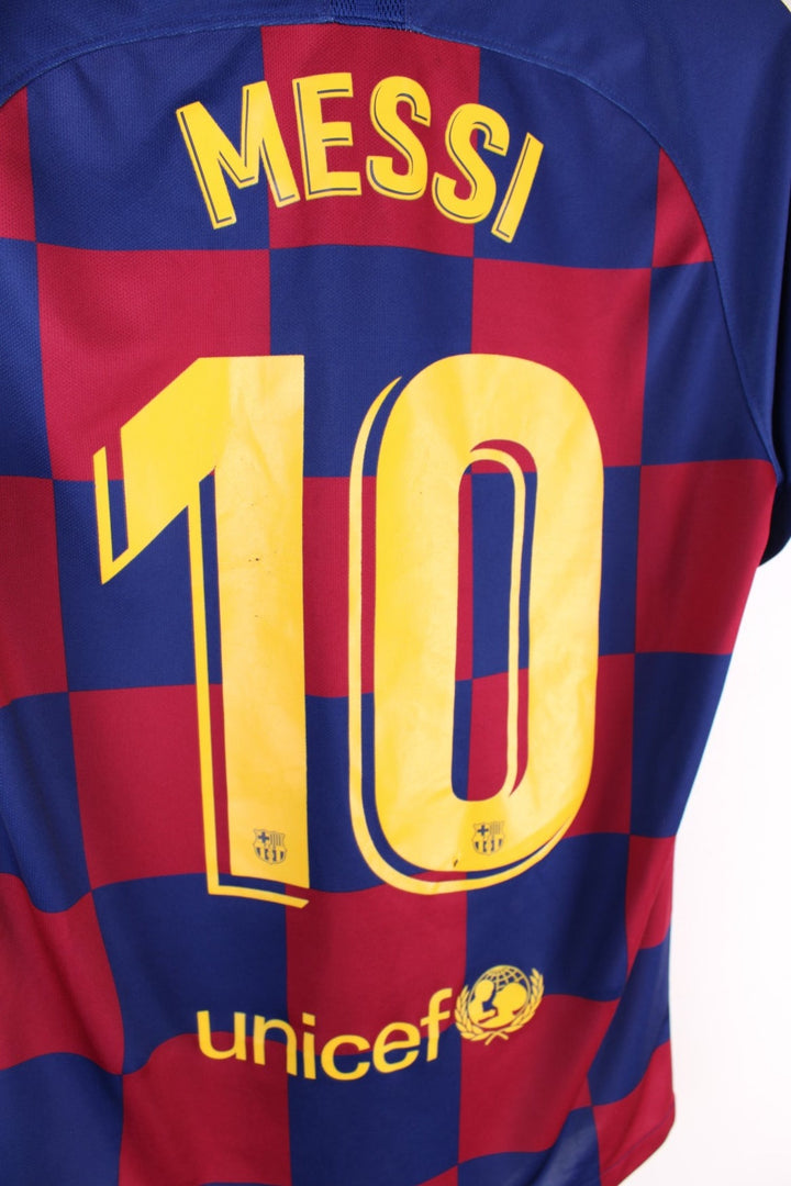 Barcelona Nike Football Shirt in the blue and red home kit colourway, features embroidered logos and badge on the front, and Messi number 10 printed on the back.