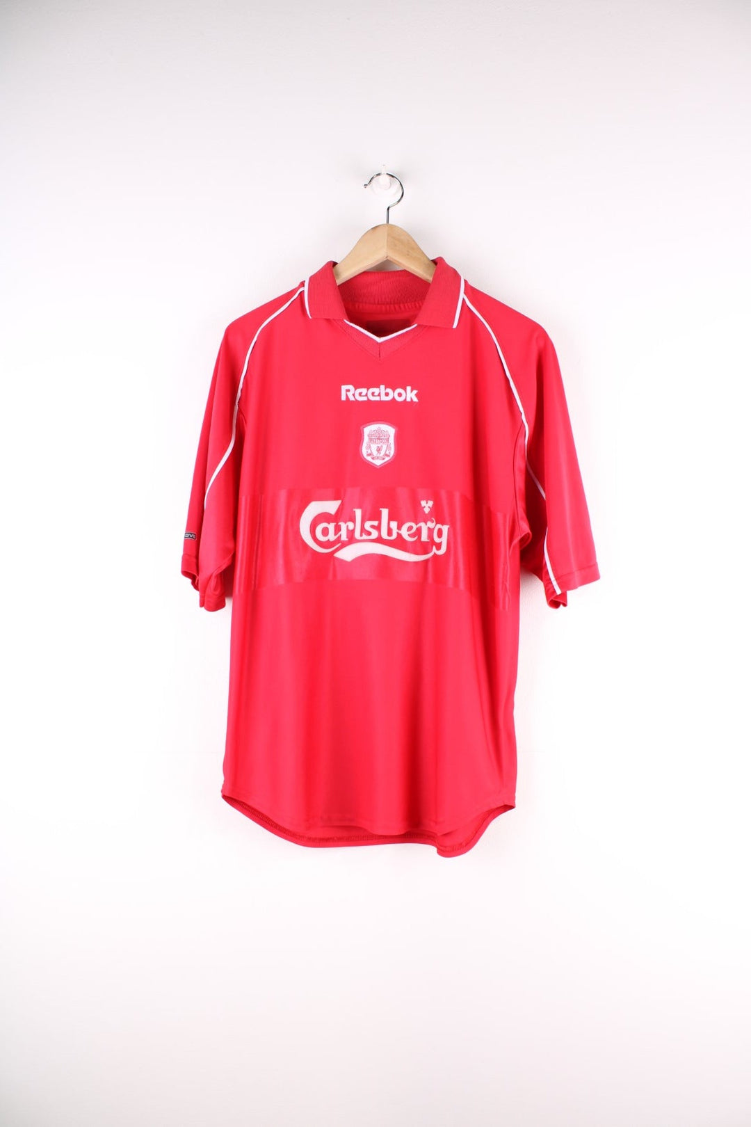 Liverpool 2000/02 Reebok Football Shirt in the red home kit colourway, features embroidered logos and badge on the front.