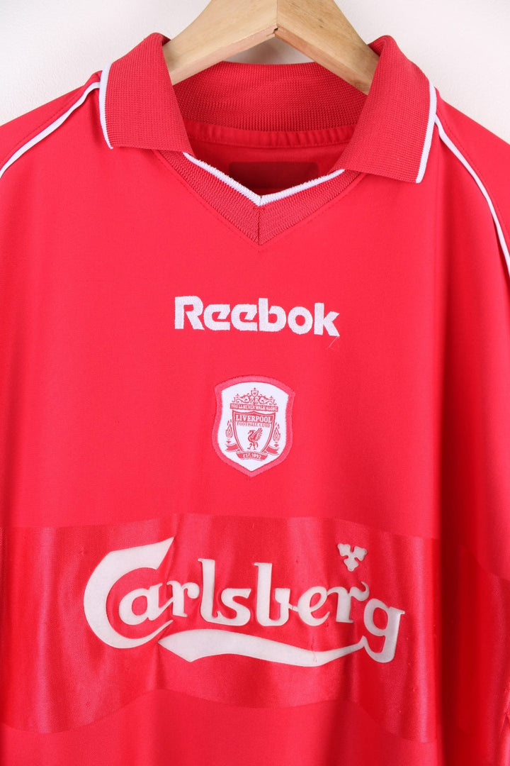 Liverpool 2000/02 Reebok Football Shirt in the red home kit colourway, features embroidered logos and badge on the front.