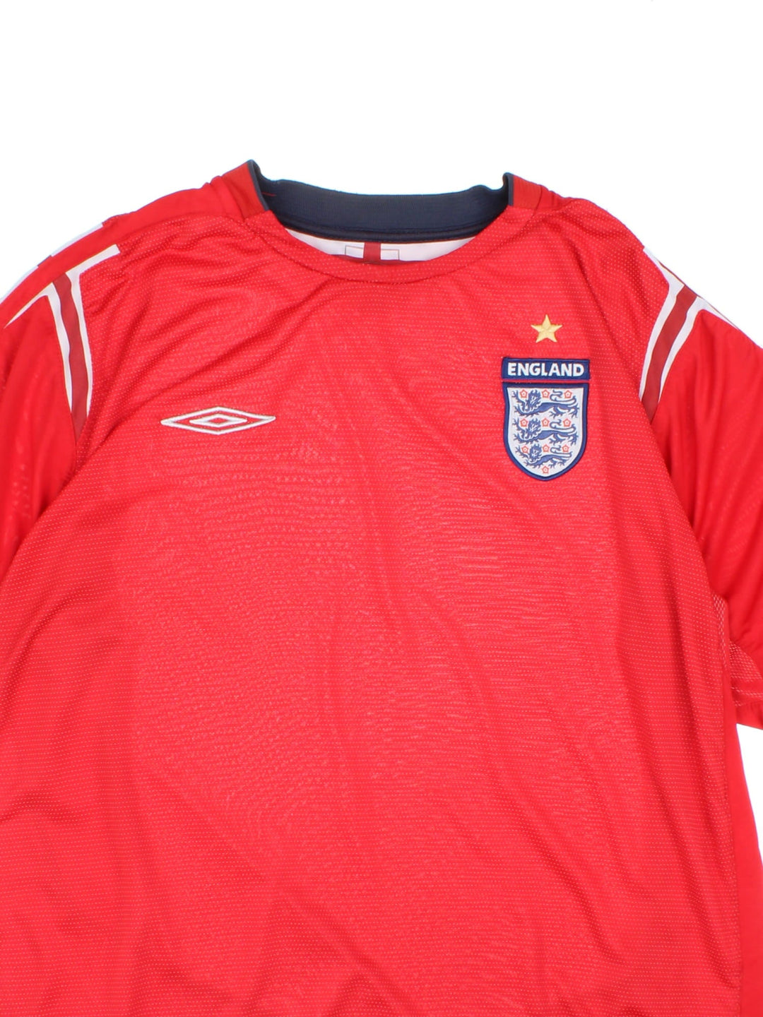 England 2004/06 Umbro Football Shirt in the red away kit colourway, features embroidered logos and badge on the front.