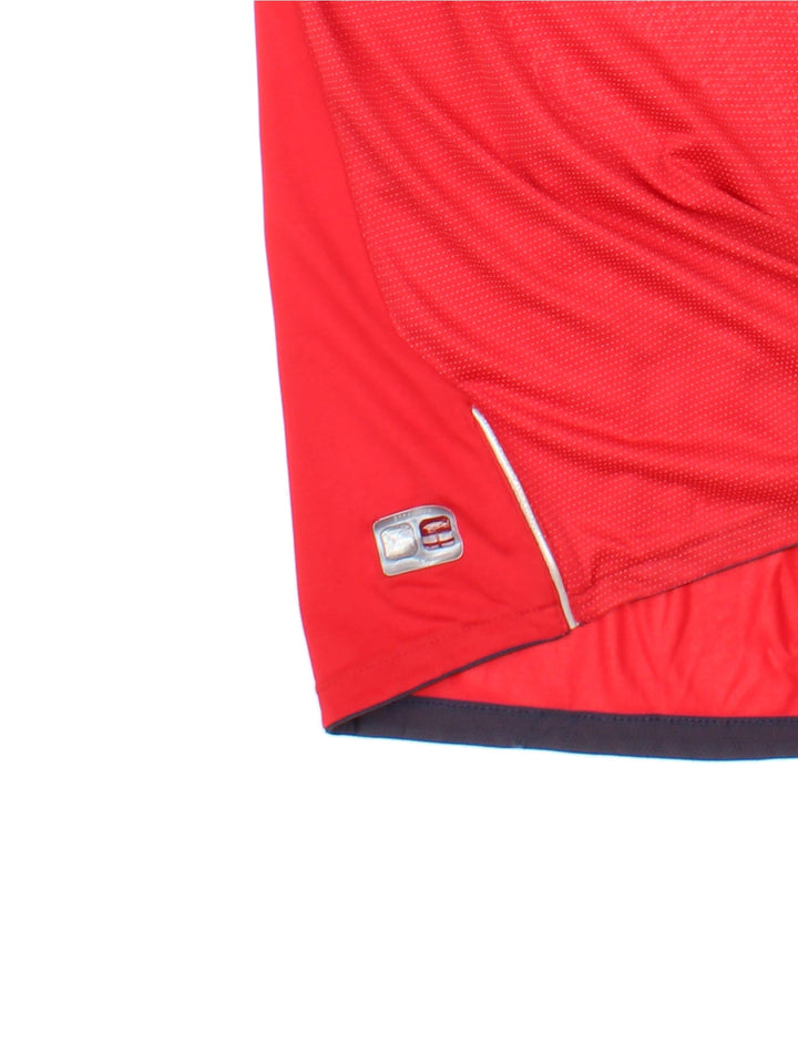 England 2004/06 Umbro Football Shirt in the red away kit colourway, features embroidered logos and badge on the front.