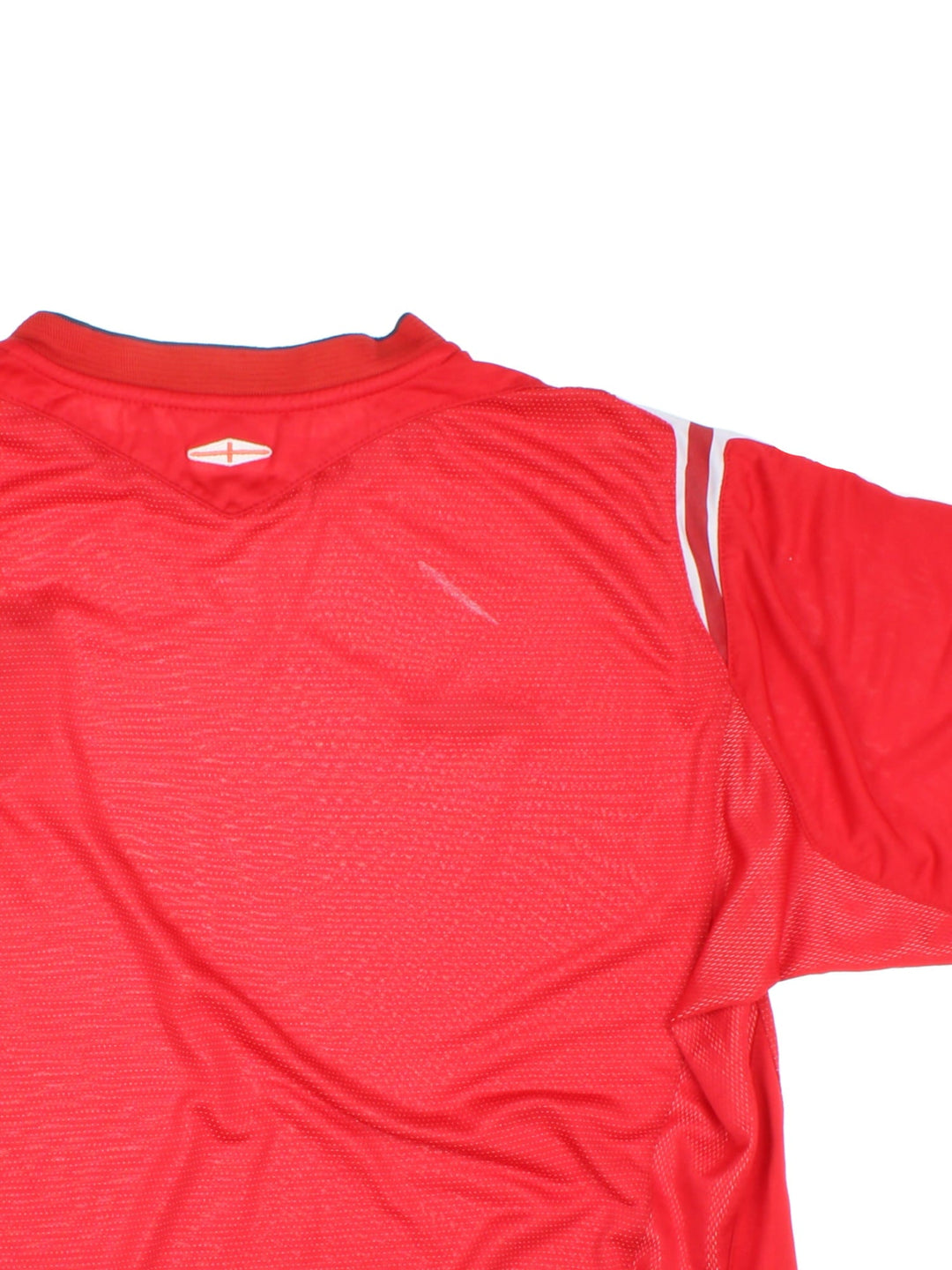 England 2004/06 Umbro Football Shirt in the red away kit colourway, features embroidered logos and badge on the front.