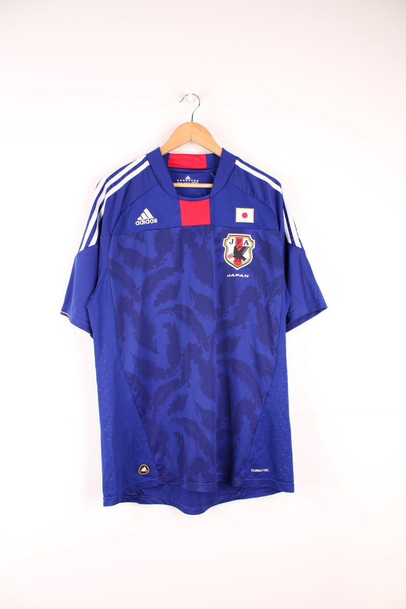 2010-11 Japan Adidas home football shirt. Features embroidered logo on the chest.