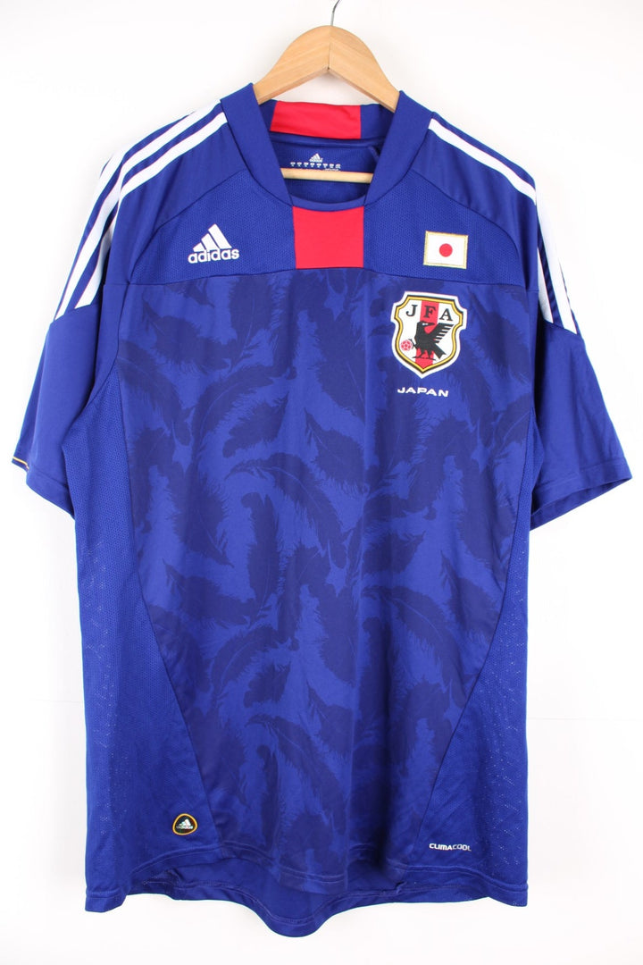 2010-11 Japan Adidas home football shirt. Features embroidered logo on the chest.