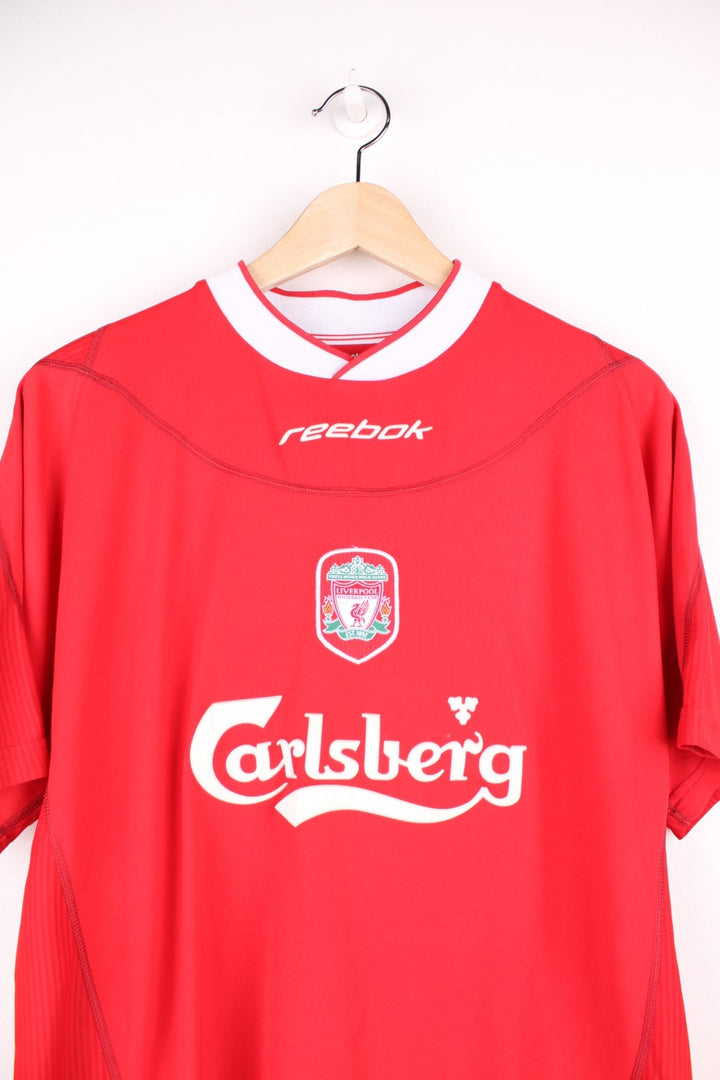 Liverpool 2002/04  Football Shirt in the  home colourway, features embroidered logo and badge on the front, and has Harry Kewell number 7 printed on the back.