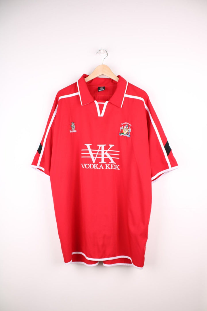 Barnsley 2004/05 Football Shirt in the red home colourway, features embroidered logo and badge on the front.