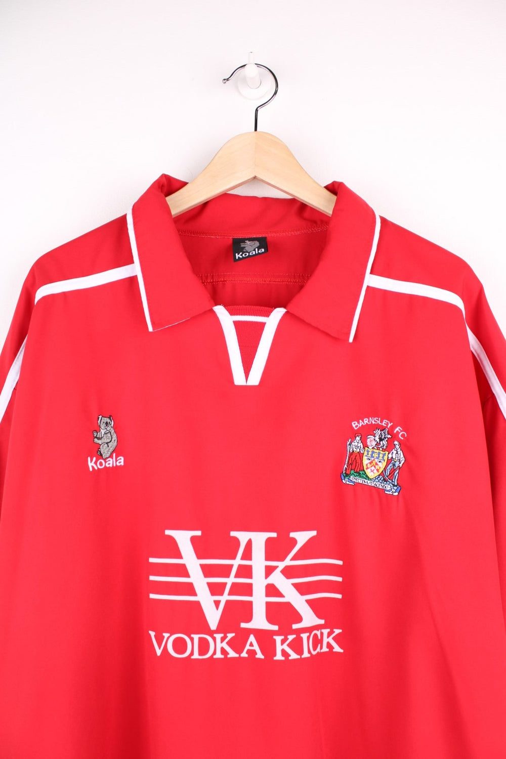 Barnsley 2004/05 Football Shirt in the  home colourway, features embroidered logo and badge on the front.