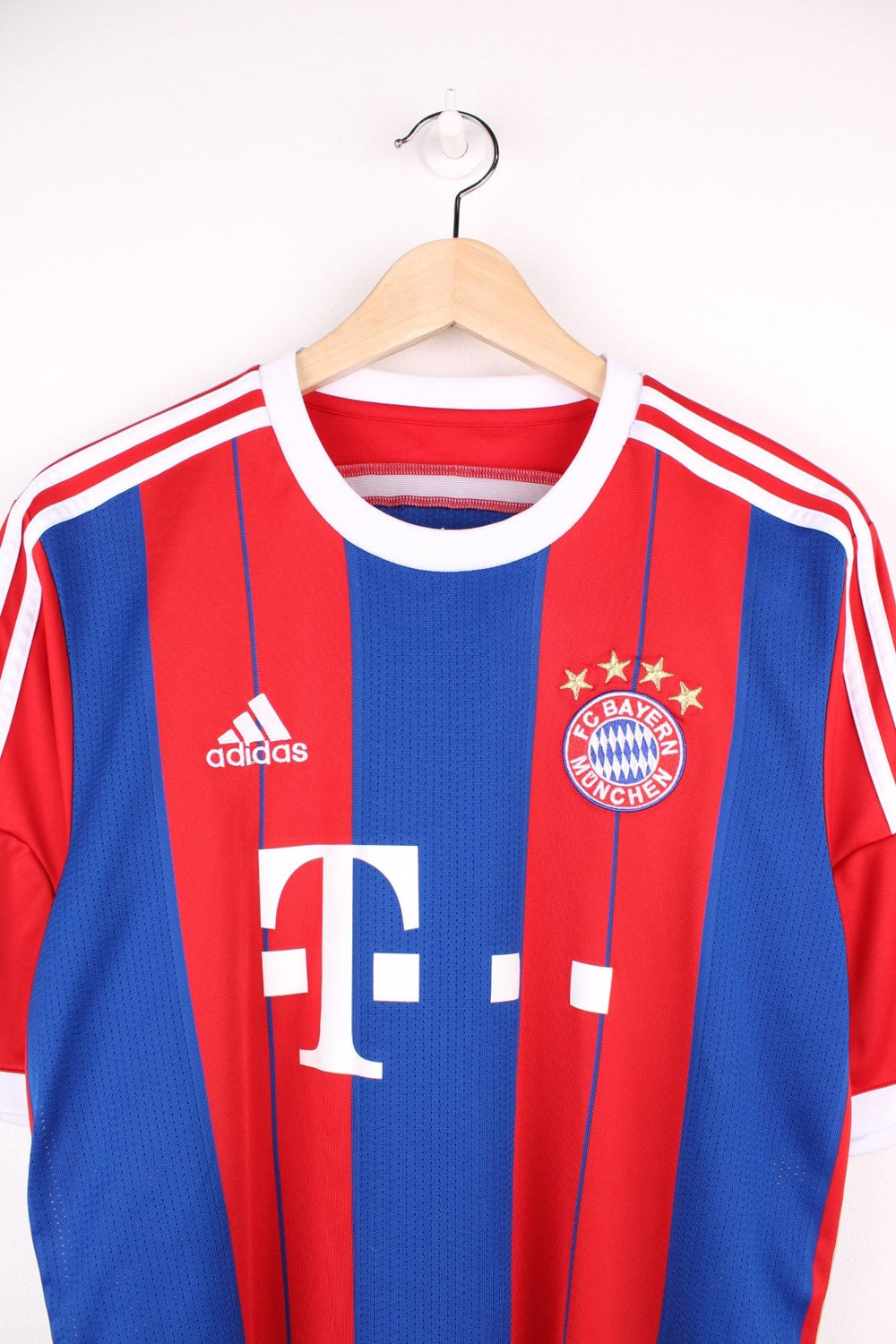 Bayern Munich 2014/15  Football Shirt in the  and blue home colourway, features embroidered logo and badge on the front.