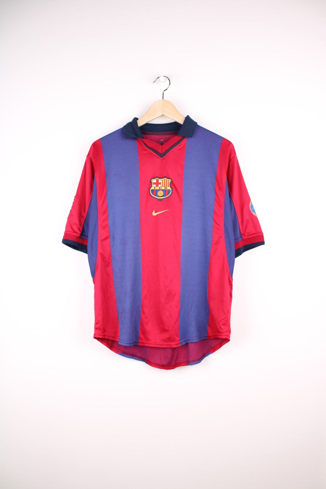 Barcelona 1998/99 Nike Football Shirt in the red and blue home colourway, features embroidered logo and badge on the front.