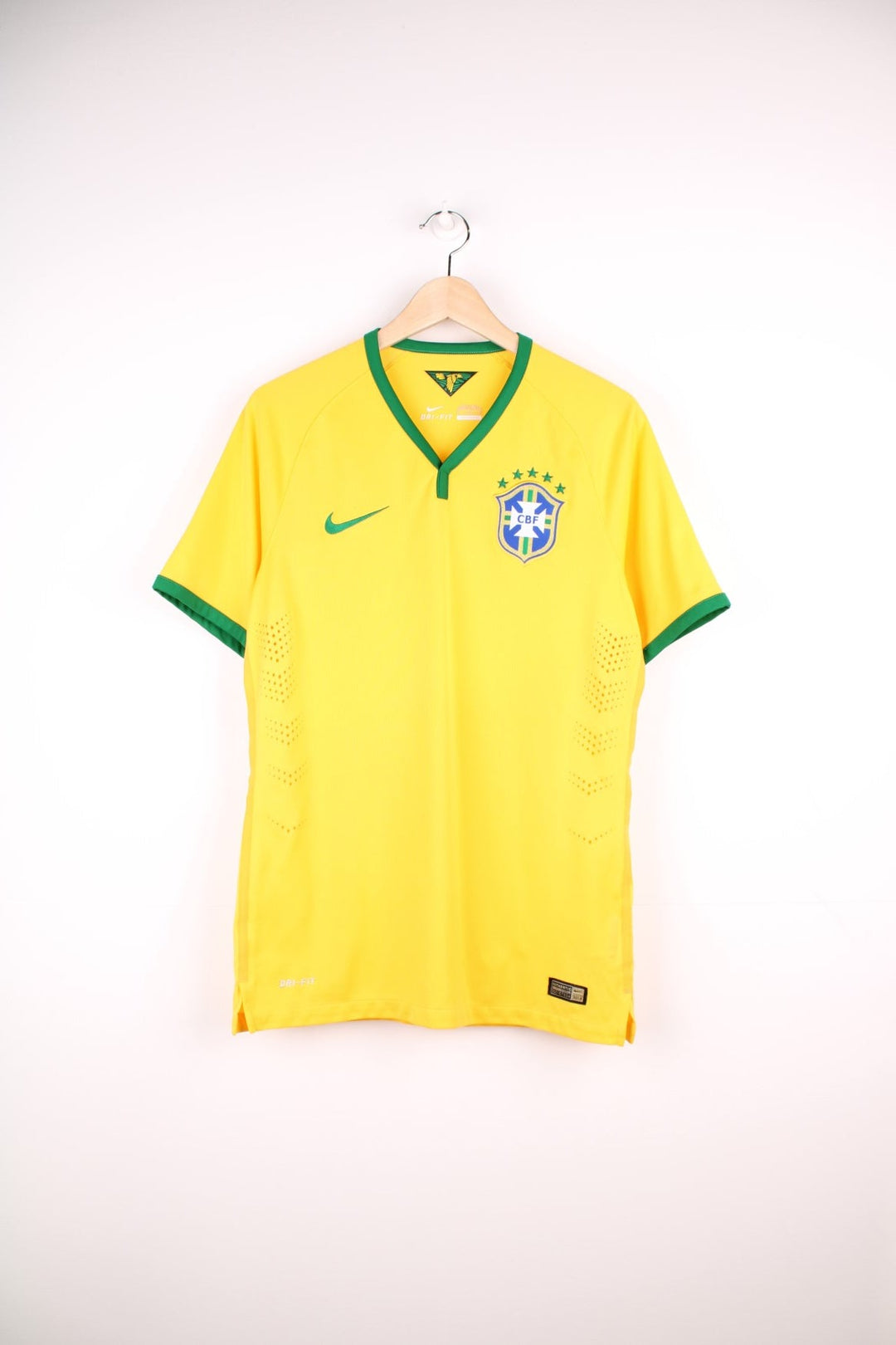 Brazil 2014/15 Nike Football Shirt in the yellow home kit colourway, features embroidered logo and badge on the front.