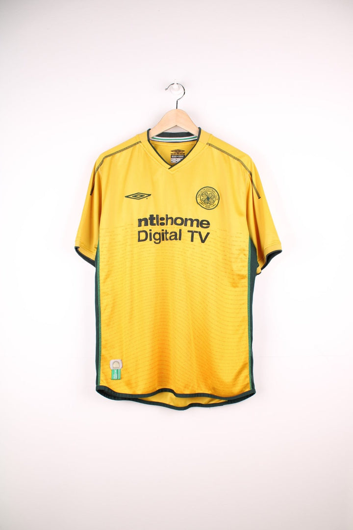 Celtic 2002/03 Umbro Football Shirt in the yellow away kit colourway, features embroidered logo and badge on the front.