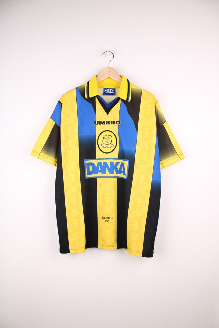 Everton 1996/97 Umbro Football Shirt in the yellow, blue and black away kit colourway, features embroidered logo and badge on the front.