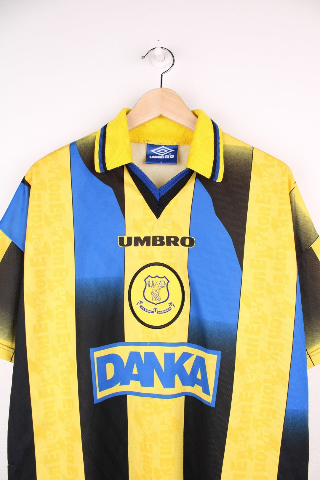 Everton 1996/97  Football Shirt in the , blue and black away kit colourway, features embroidered logo and badge on the front.