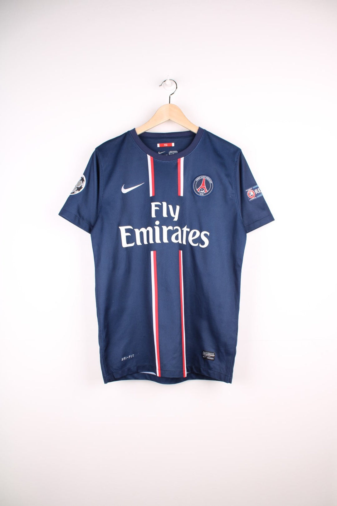 Paris Saint Germain 2012/13 Nike Football Shirt in the blue home kit colourway, features embroidered logo and badge on the front, and has David Beckham number 32 printed on the back.