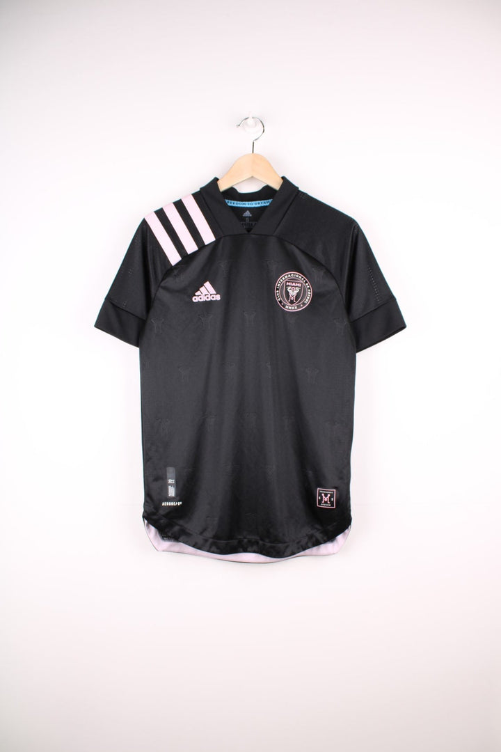 Inter Miami 2020/21 Adidas Football Shirt in the black and pink away kit colourway, features printed logo and badge on the front.