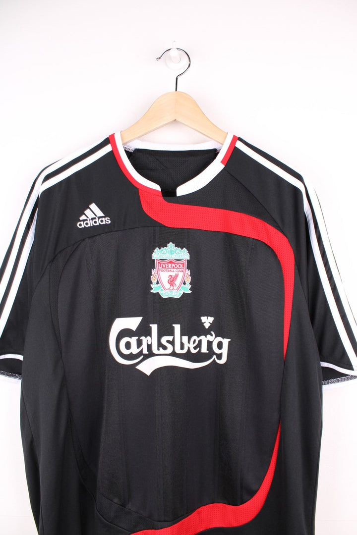 Liverpool 2007/08  Football Shirt in the  third kit colourway, features embroidered logo and badge on the front.