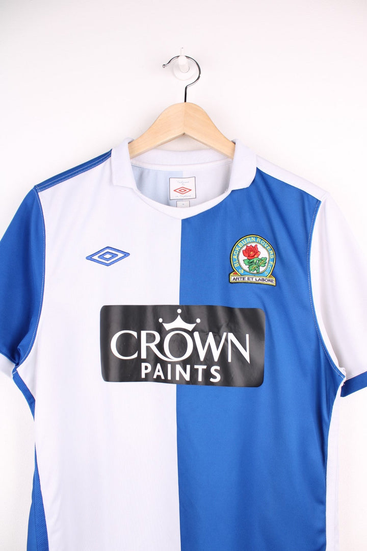 Blackburn Rovers 2010/11  Football Shirt in the  and blue home kit colourway, features embroidered logo and badge on the front.