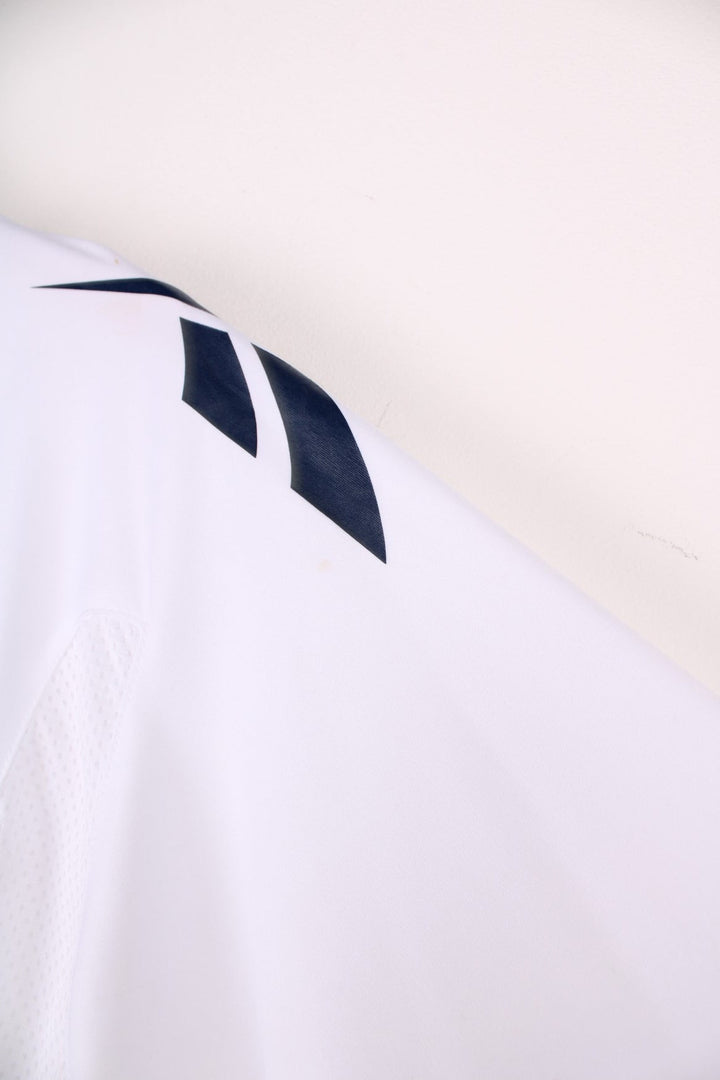 Bolton Wanderers 2010/11 Team Signed  Football Shirt in the  home kit colourway, features embroidered logo and badge on the front, as well as signatures all over.