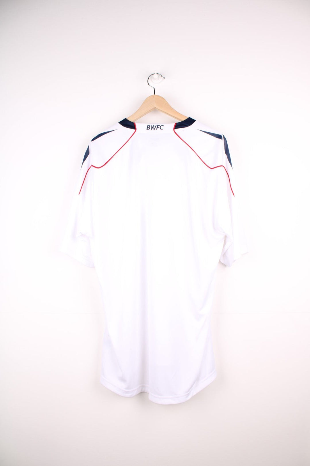 Bolton Wanderers 2010/11 Team Signed  Football Shirt in the  home kit colourway, features embroidered logo and badge on the front, as well as signatures all over.