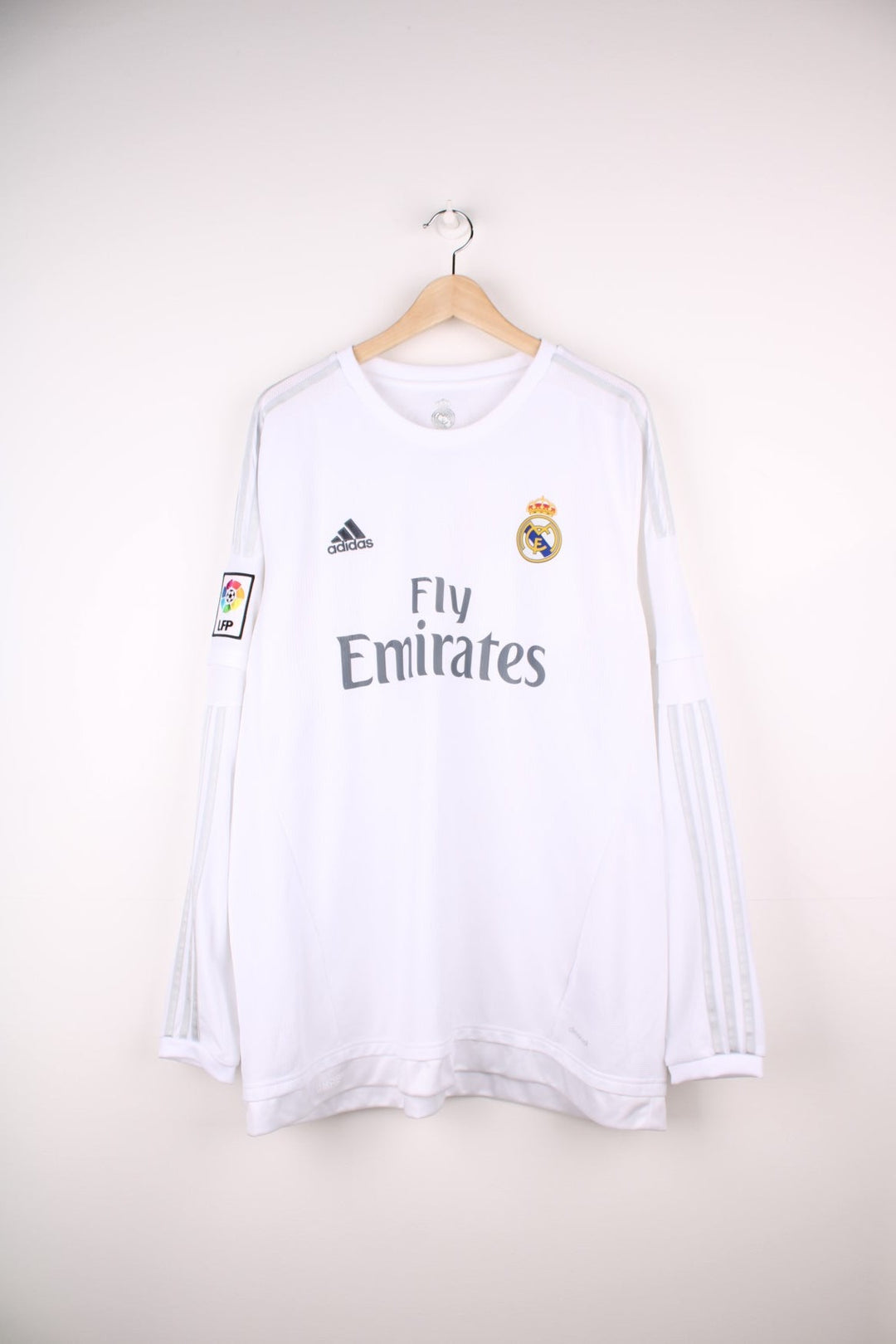 Real Madrid 2015/16 Adidas Longsleeve Football Shirt in the white home kit colourway, features embroidered logo and badge on the front.