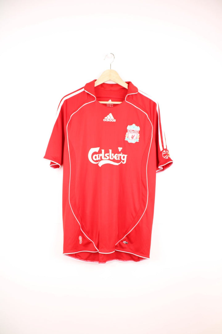 Liverpool 2006/07 Adidas Home Football Kit in the red and white team colourway, has Robbie Fowler number 9 printed on the back, and on the front the logos and sponsor. 