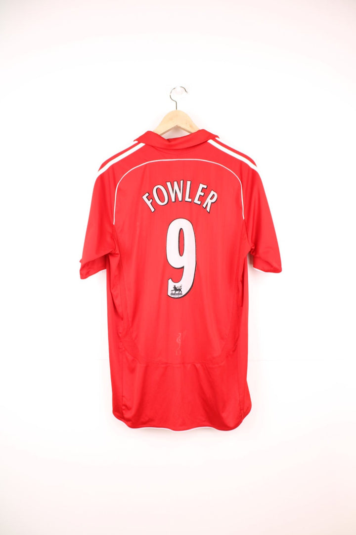 Liverpool 2006/07 Adidas Home Football Kit in the red and white team colourway, has Robbie Fowler number 9 printed on the back, and on the front the logos and sponsor. 