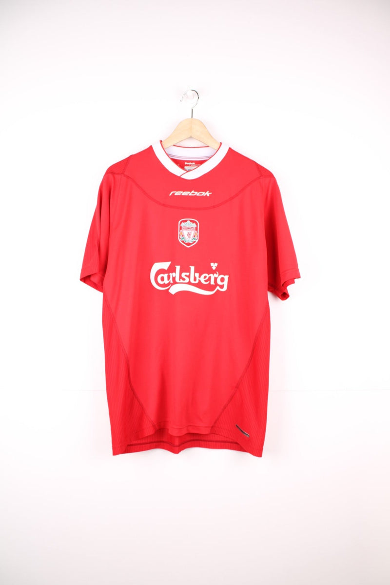 Liverpool 2002/2004 Home Reebok Football Shirt in red and white. Features embroidered badge on the chest, and puff print Reebok and sponsor logo.  