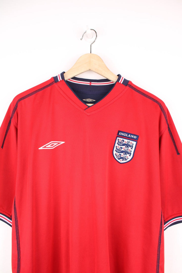 England 2002/04 Umbro Reversible Away Football Shirt in red and blue. Features embroidered logo and badge. 