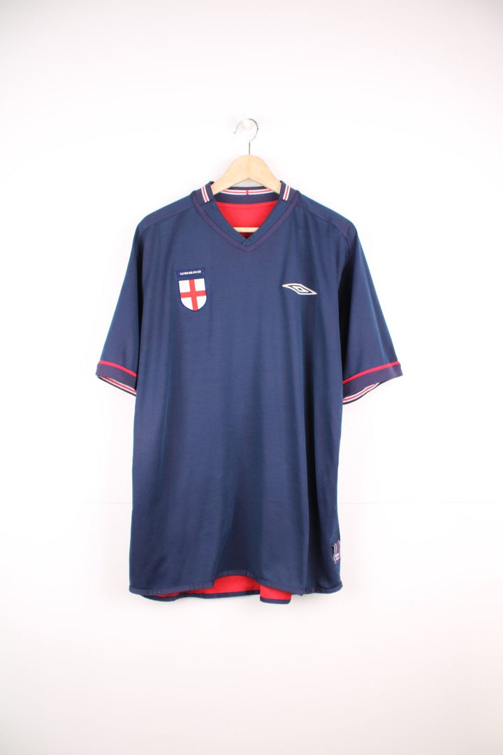 England 2002/04 Umbro Reversible Away Football Shirt in red and blue. Features embroidered logo and badge. 