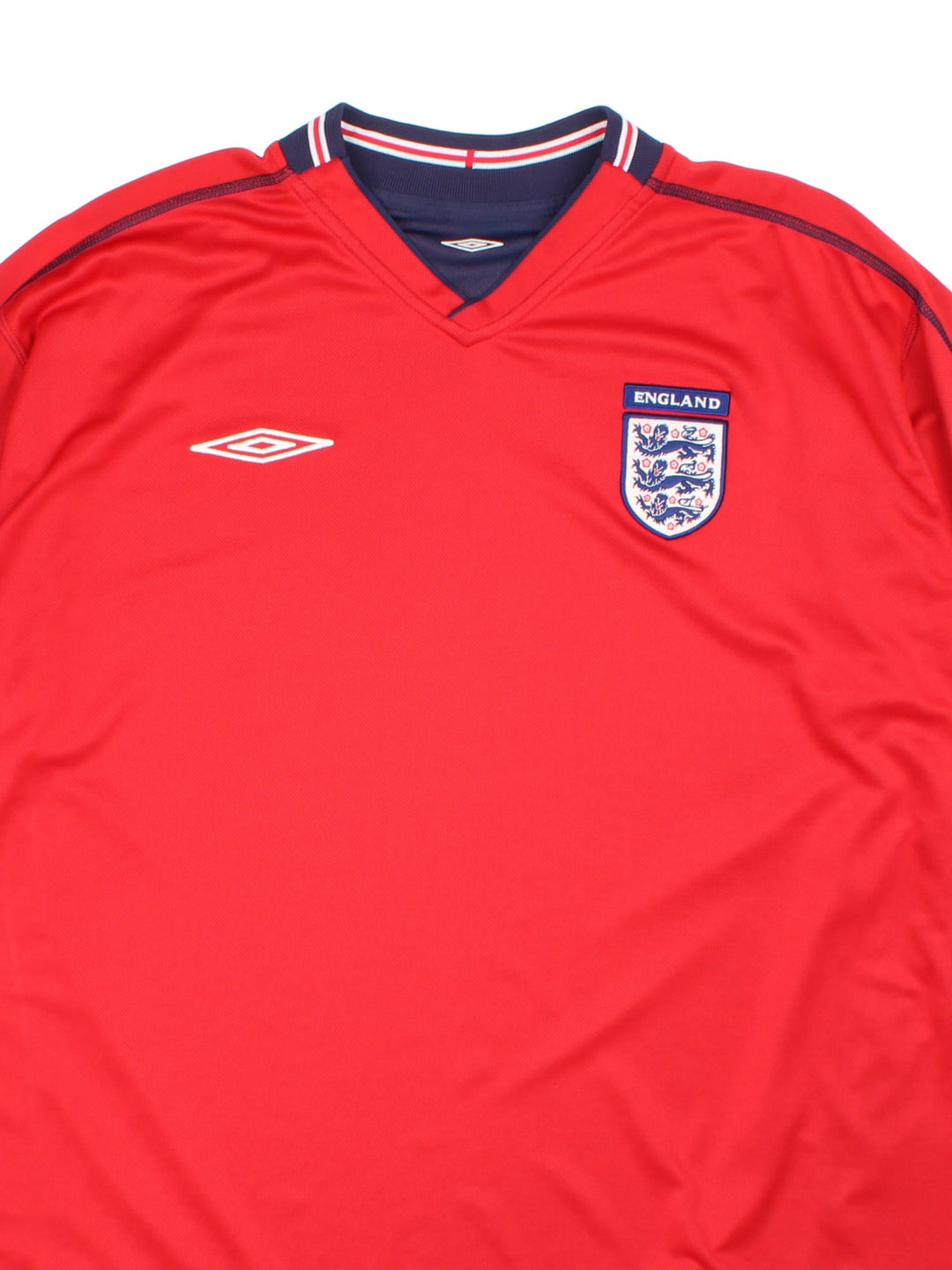 England 2002/04 Umbro Football Shirt in the red away kit colourway, features embroidered logos and badge on the front.