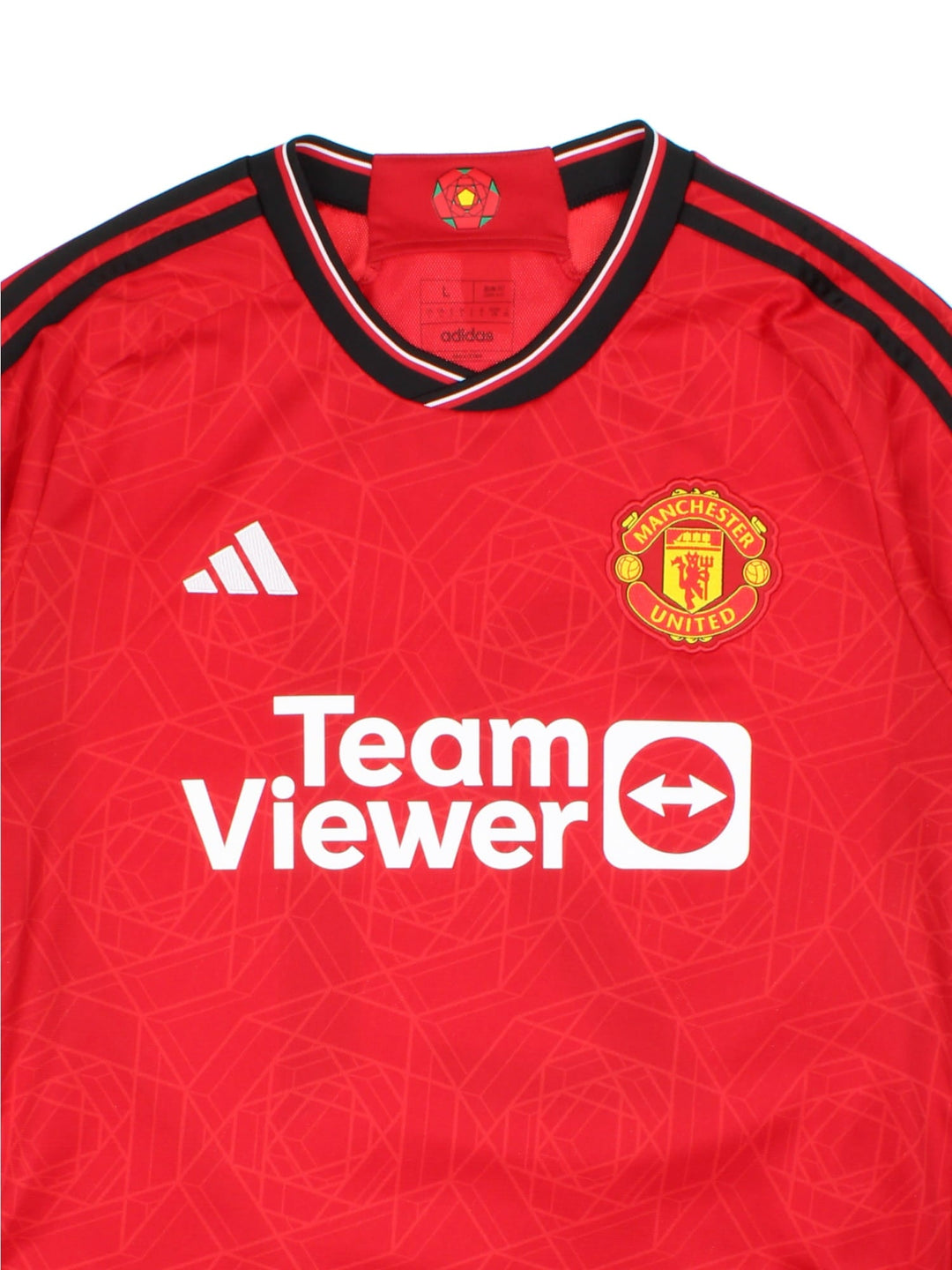 Manchester United 2023-24 Adidas Football Shirt in the red home kit colourway, features embroidered/printed logos and badge on the front.