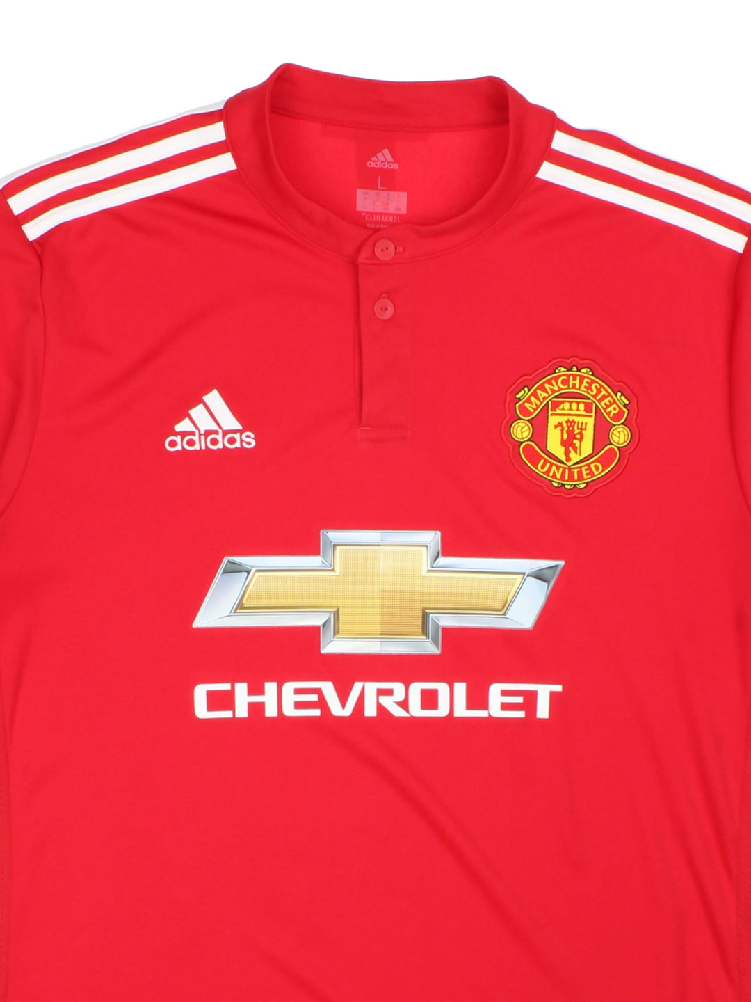 Manchester United 2017-18 Adidas Football Shirt in the red home kit colourway, features embroidered/printed logos and badge on the front.