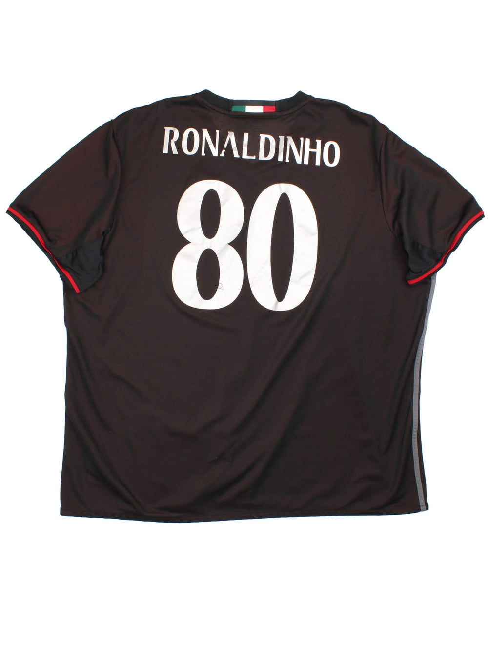 AC Milan 2016-17 Football Shirt Adidas Football Shirt in the red/black home kit colourway, features printed/embroidered logos and badge on the front, and Ronaldinho number 80 printed on the back.