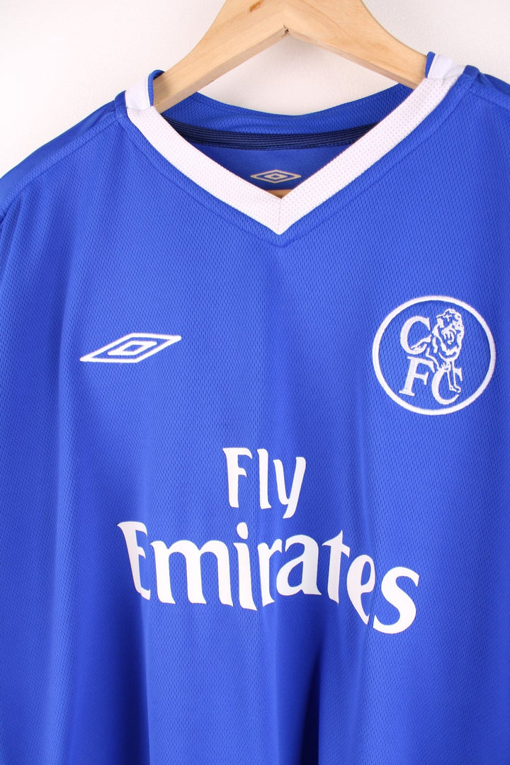 Chelsea 2003/05  Football Shirt in the  home kit colourway, v neck and features embroidered logos and badge on the front.