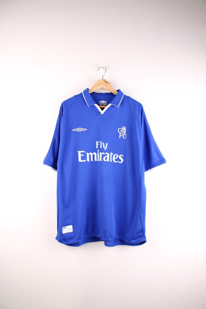 Chelsea 2001/03 Umbro Football Shirt in the blue home kit colourway, features embroidered logos and badge on the front.