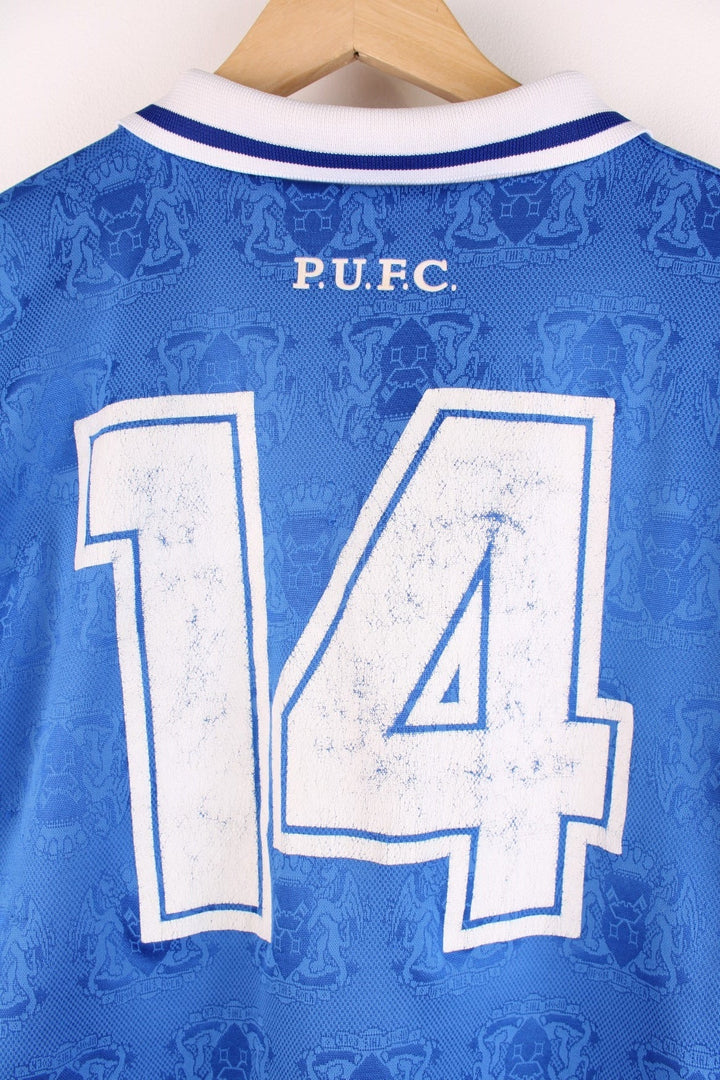  Peterborough United 1995/96 Home Football Shirt in the  and white team colourway, features embroidered logos and badge on the front and the number 14 printed on the back.