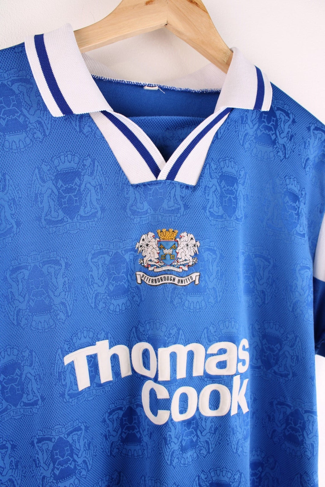  Peterborough United 1995/96 Home Football Shirt in the  and white team colourway, features embroidered logos and badge on the front and the number 14 printed on the back.