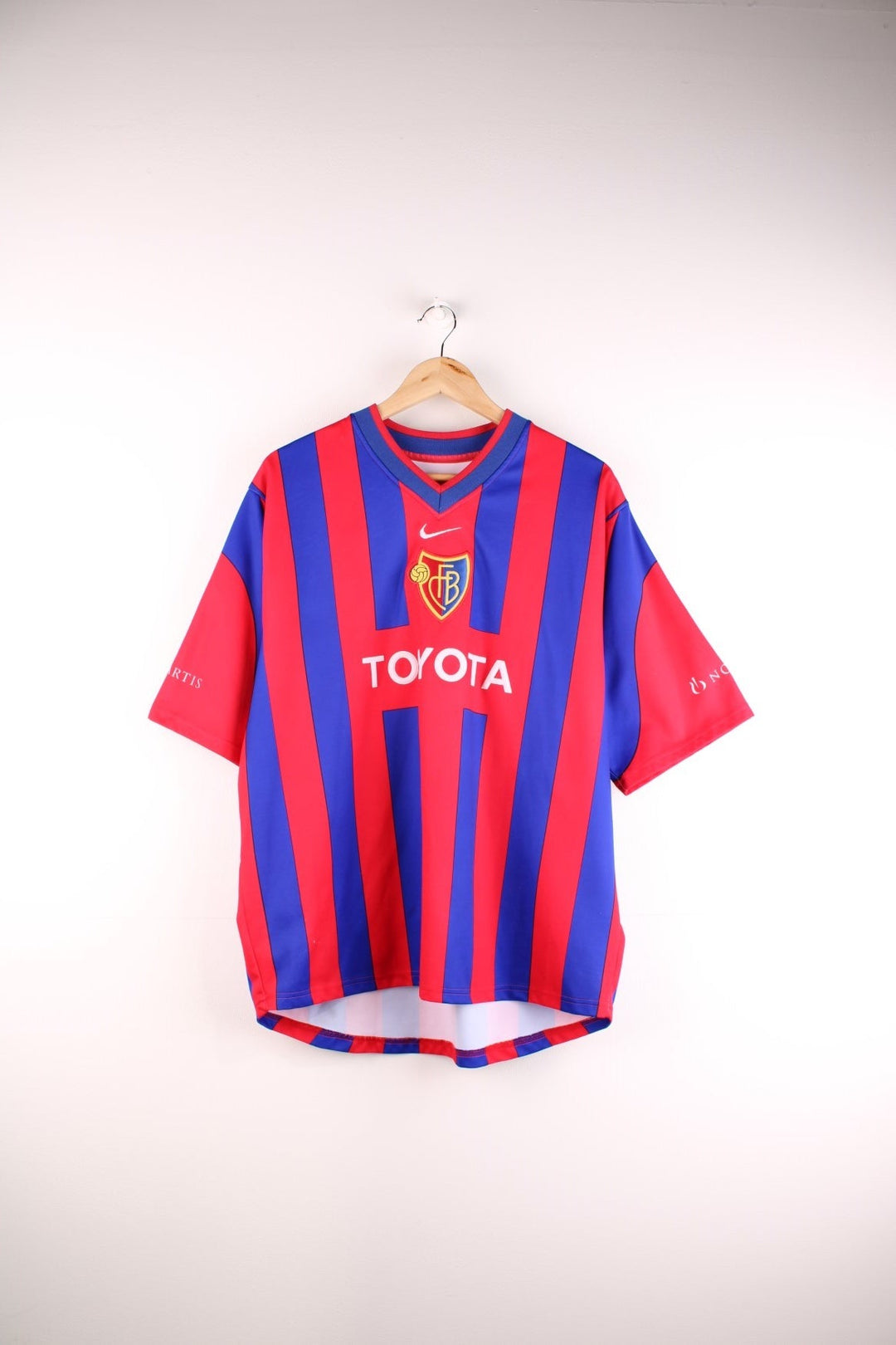 FC Basel 2001/02 Nike Football Shirt in the red and blue home kit colourway, features embroidered logos and badge on the front.